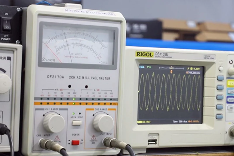 Oscilloscope and other measuring instruments at an electronics test bench